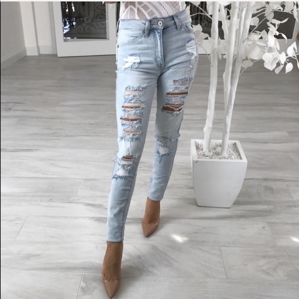 High waisted light blue distressed jeans